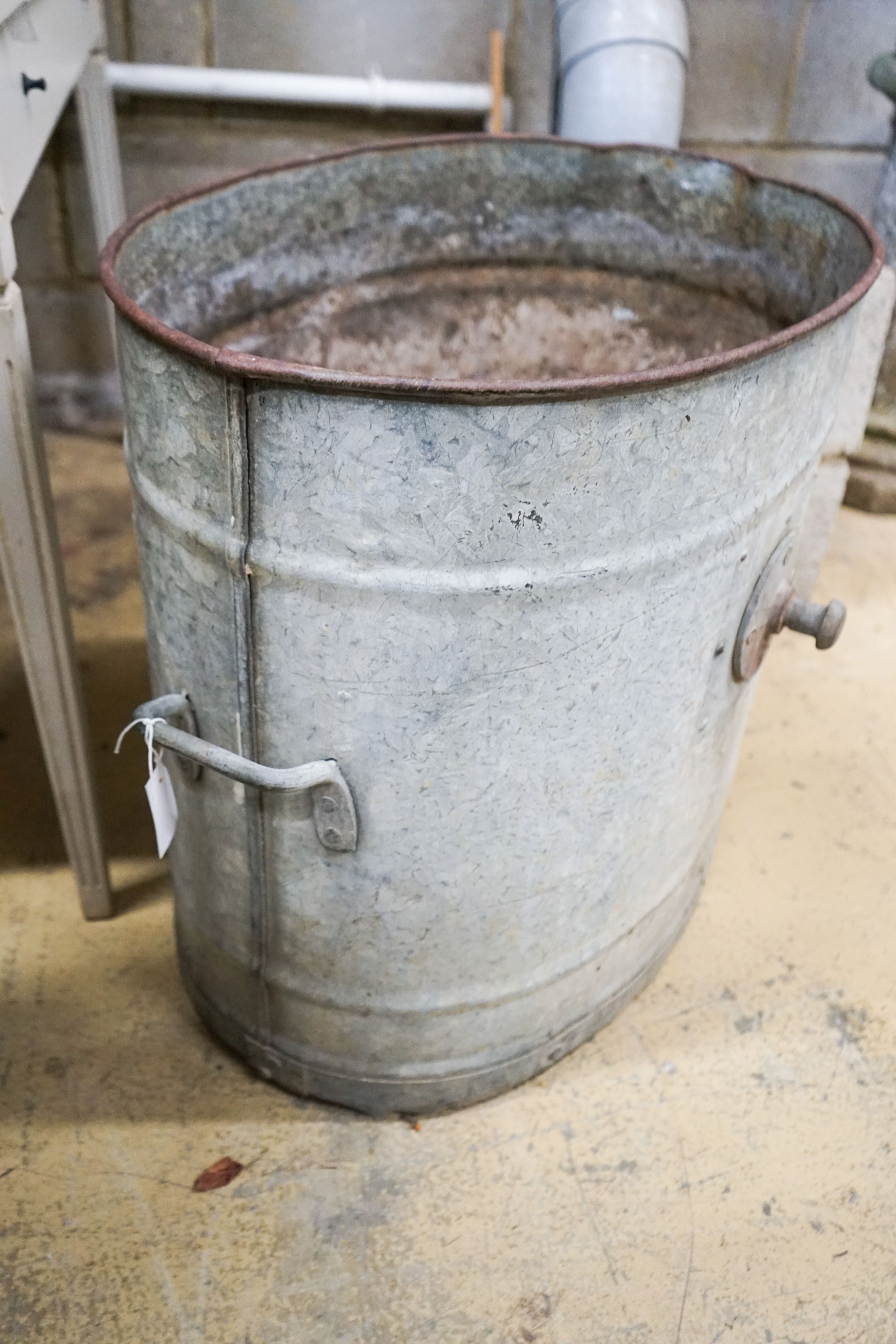 A galvanised metal tub, width 66cm height 60cm